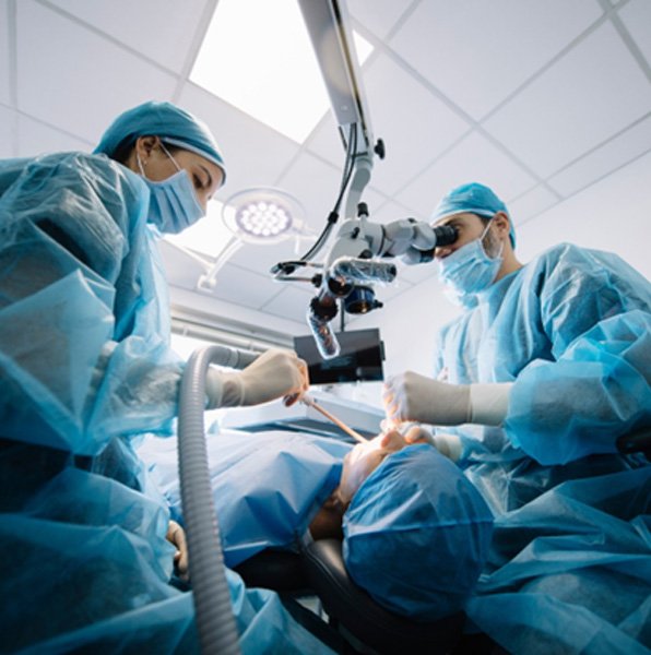 Dental team performing advanced procedure