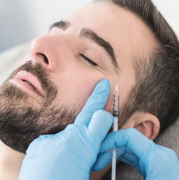 Man relaxing as he get BOTOX in Jacksonville 