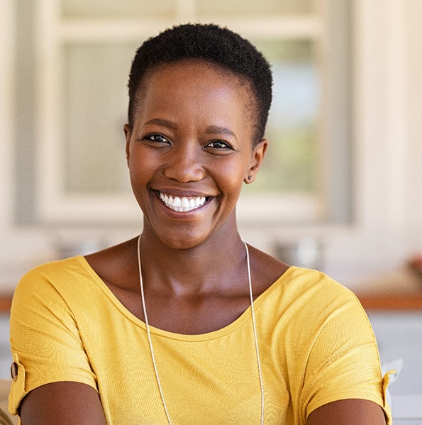 woman smiling with a dental bridge in Jacksonville