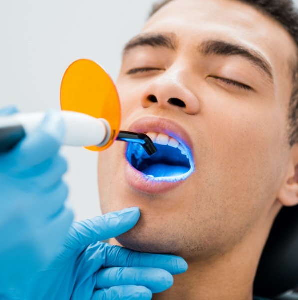 Patient receiving cosmetic dental bonding