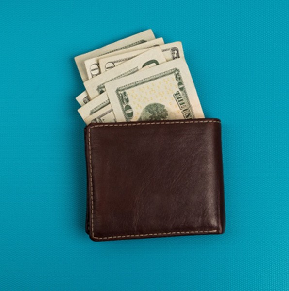 Wallet of money on blue background