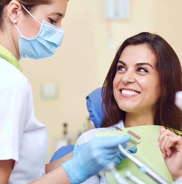 Patient smiling at Jacksonville dentist during appointment