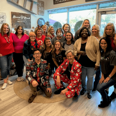 Jacksonville dentists and team members posing in reception area