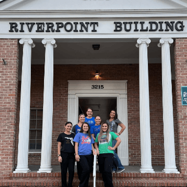 Jacksonville dental team outside of Riverpoint Building
