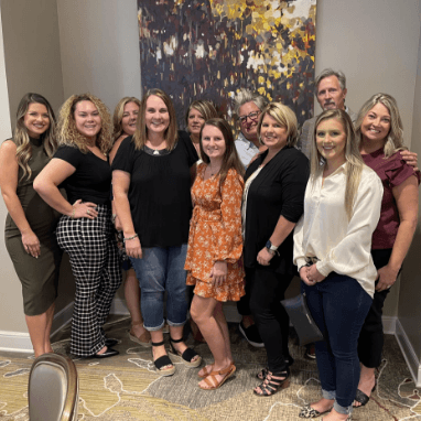 Dentists and dental team wearing formal clothing in Jacksonville dental office