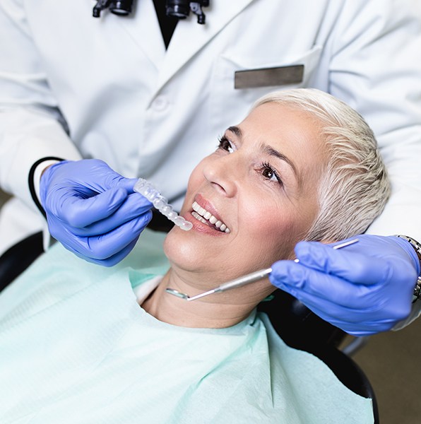 Woman being fitted with a nightguard for bruxism