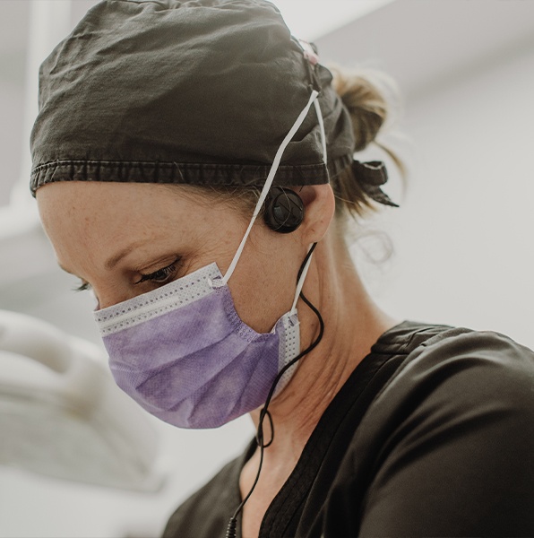 Dentist treating patient under nitrous oxide dental sedation