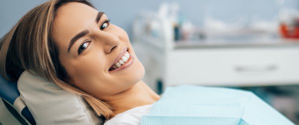 Smiling woman at preventive dentistry visit