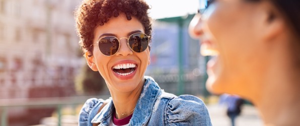 Woman with flawless smile after cosmetic dentistry